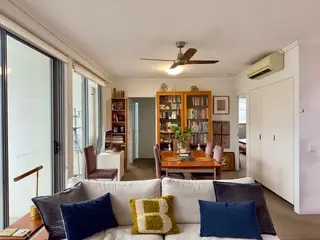 Wooden dining table, in the frame that shows it